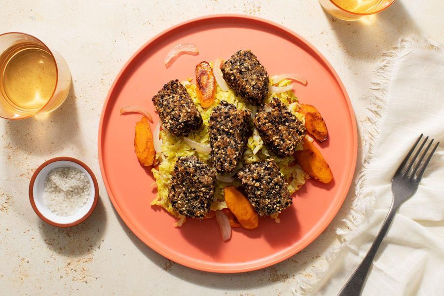 Crispy sesame-crusted fish nuggets with orange-glazed vegetables