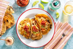 Salmon tacos with cabbage slaw, salsa roja, and chipotle yogurt