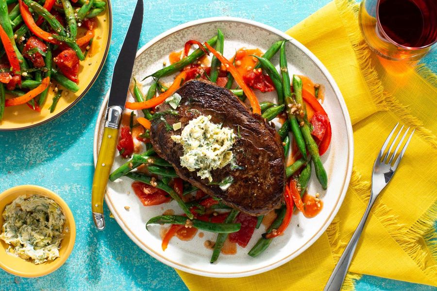 Black Angus rib-eyes with artichoke butter and green beans