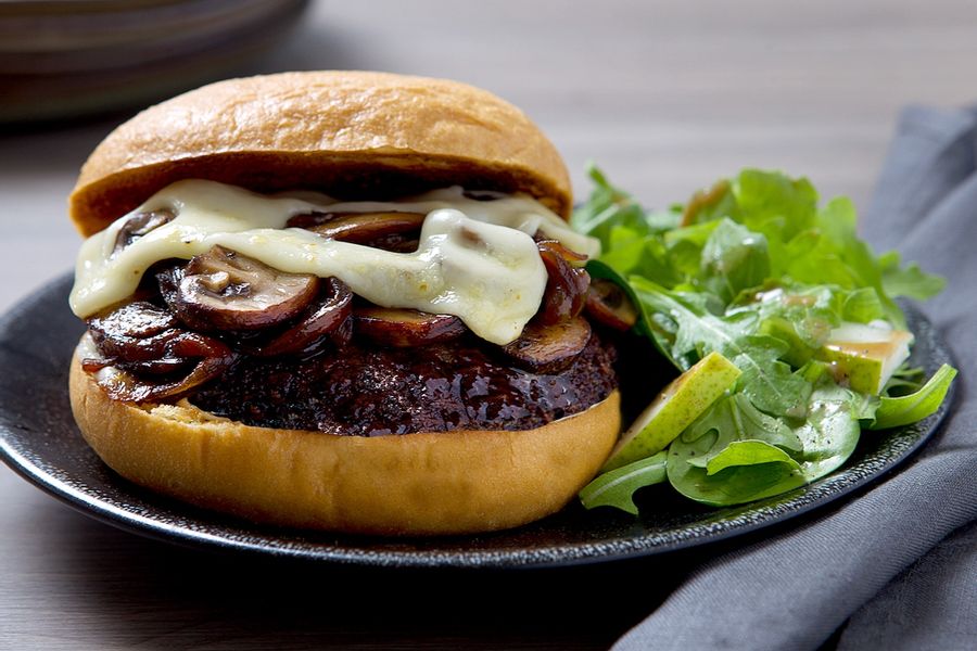 Mushroom-Swiss Wagyu burgers with truffle butter and spinach-pear salad