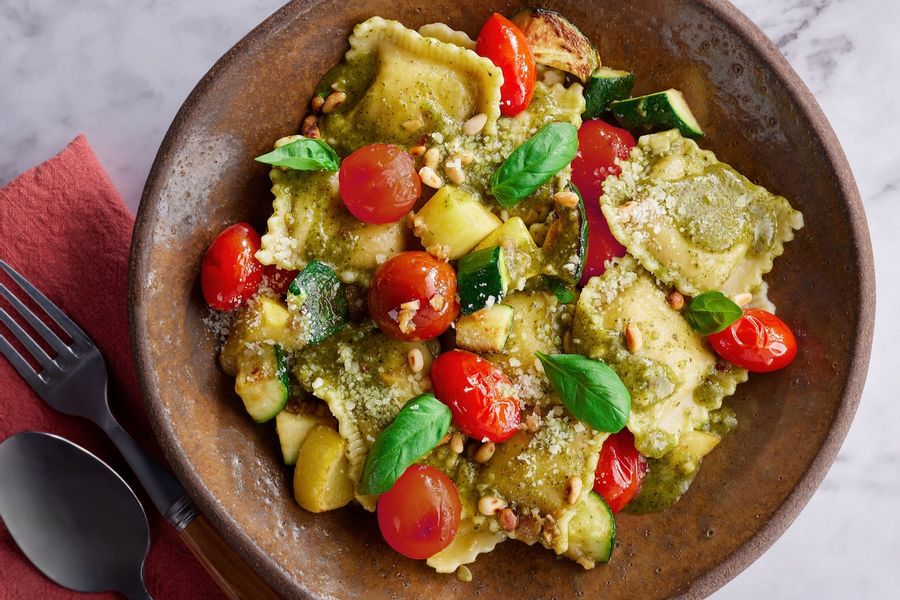 Caprese three-cheese ravioli with pesto and grape tomatoes