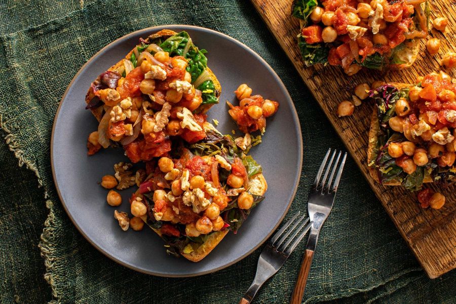 Moroccan-spiced chickpeas and wilted chard on garlic toasts