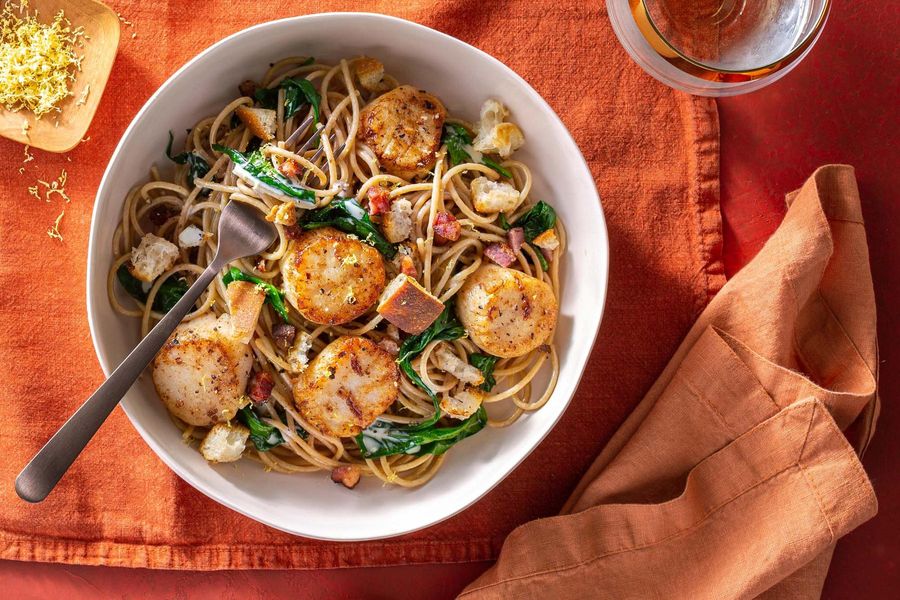 Seared scallops over spaghetti with pancetta and lemon-Parmesan sauce
