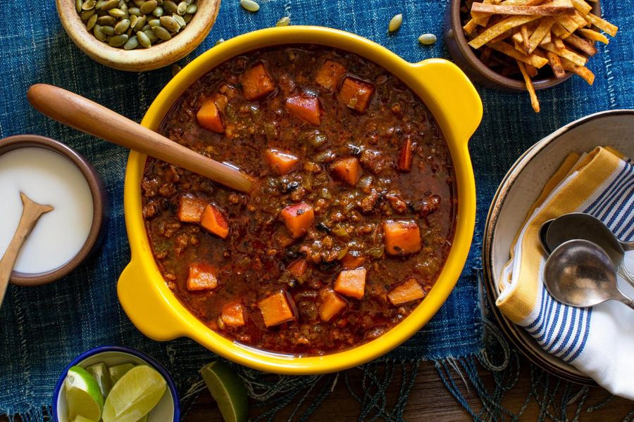 Spicy chorizo and tomatillo chili with sweet potato and pumpkin seeds