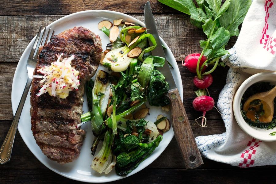 Grilled steaks with broccoli rabe and radish butter