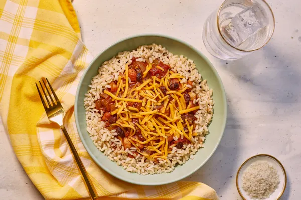 Three bean chili with brown rice and cheddar cheese