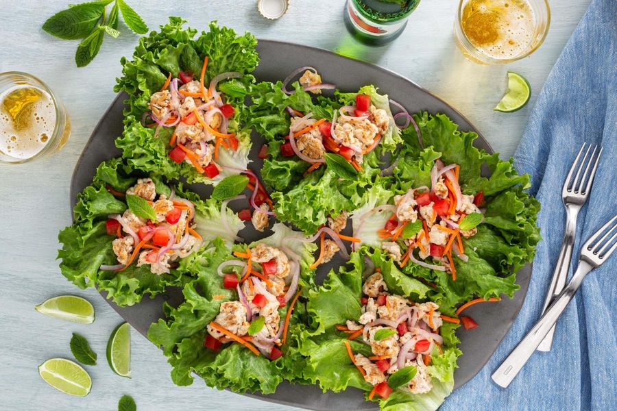 Chicken larb lettuce cups with carrots and fresh mint