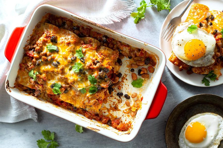 Two-bean enchiladas with green chiles and fried eggs