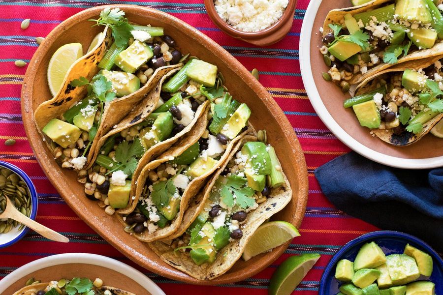 Corn and black bean tacos with avocado and queso fresco