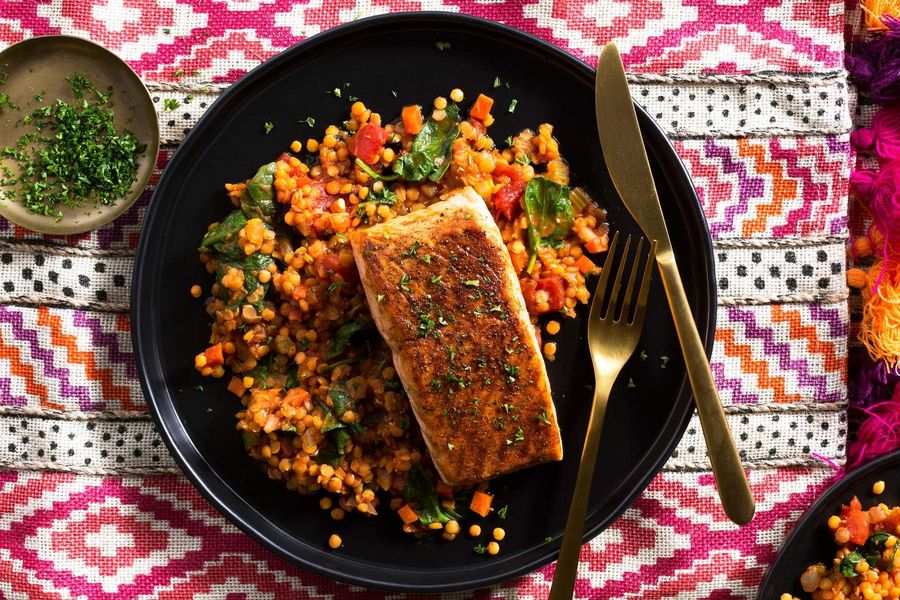 Moroccan salmon with stewed tomatoes, lentils, and baby spinach