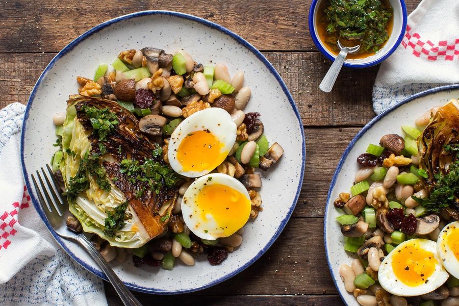 White bean salad with roasted cabbage, chimichurri, and soft-cooked eggs