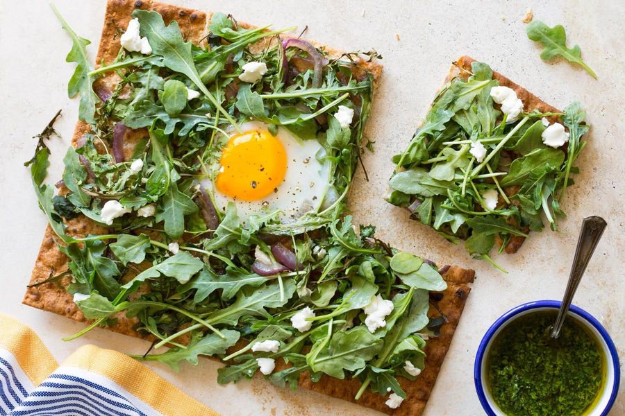 Flatbreads with goat cheese, soft-cooked eggs, and arugula