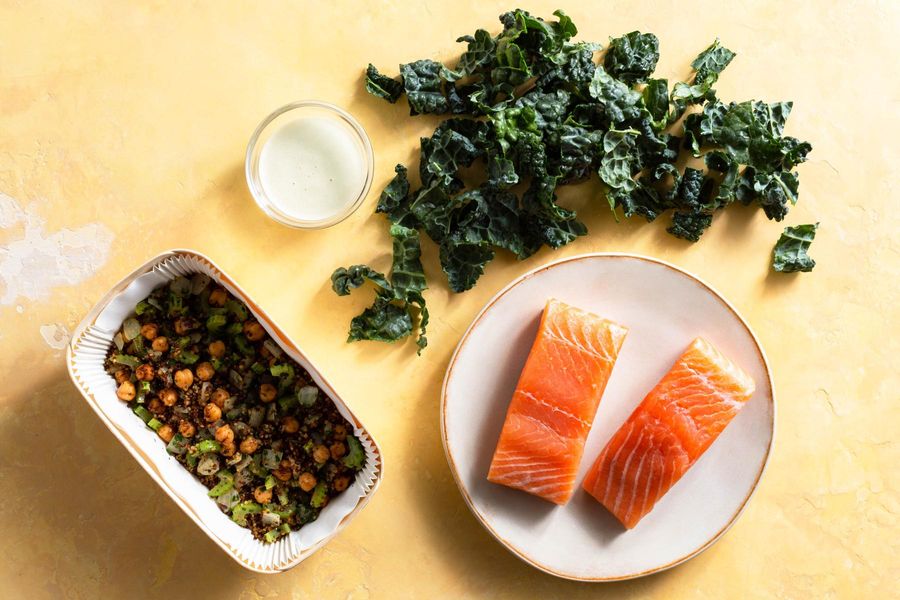 Salmon and quinoa bowls with wilted greens and citrus dressing