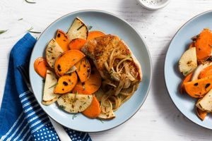 Pork with caramelized onion and rosemary-roasted root vegetables