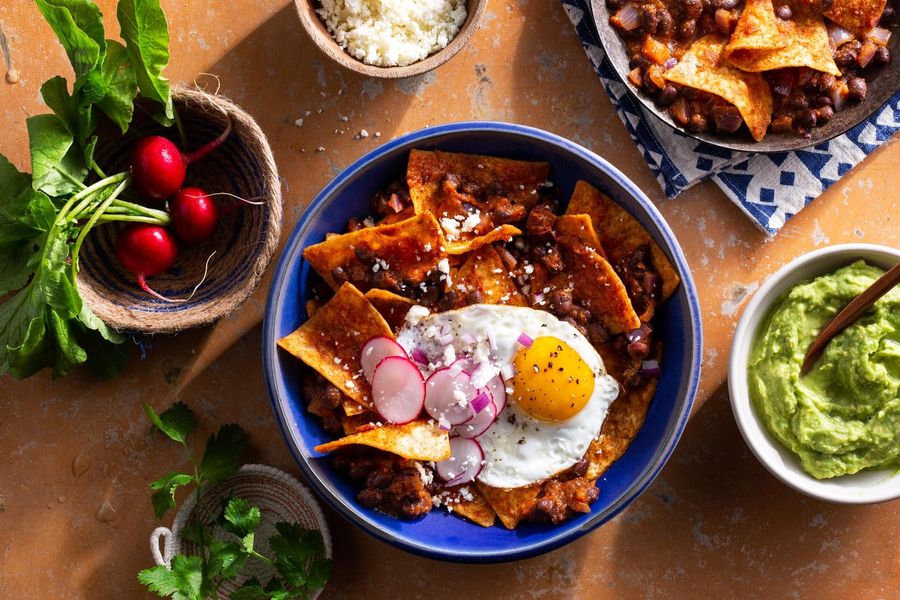 Chipotle chilaquiles with black beans and fried eggs