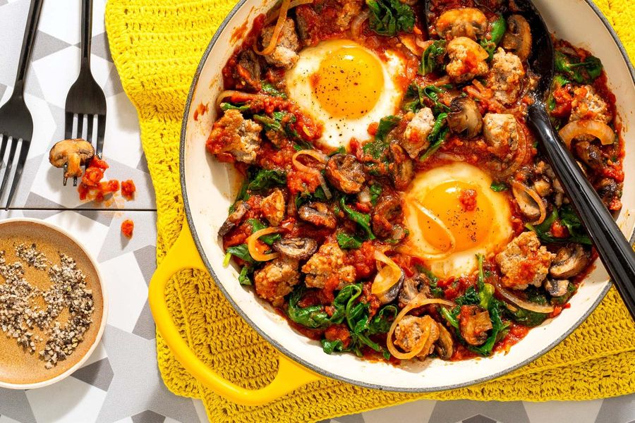 Eggs in purgatory on spicy turkey, mushroom, and kale hash
