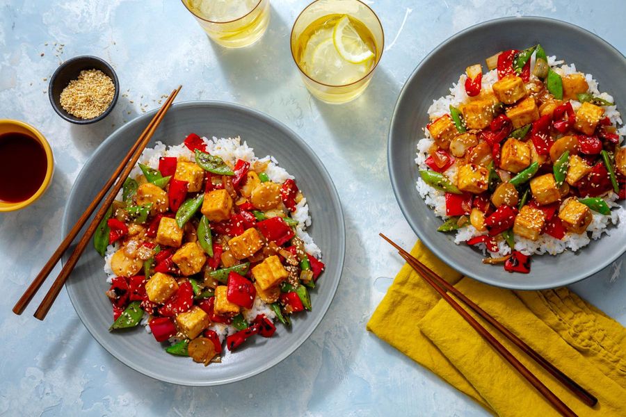 Sweet and sour tofu with water chestnuts, snap peas, and white rice