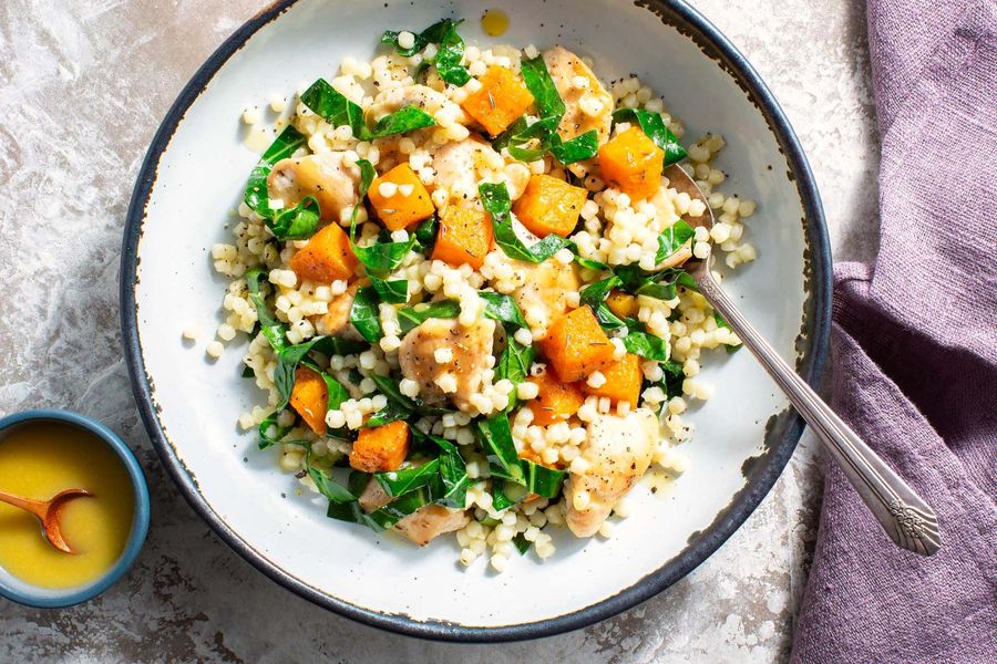 Couscous salad with chicken, butternut squash, and broccoli leaves