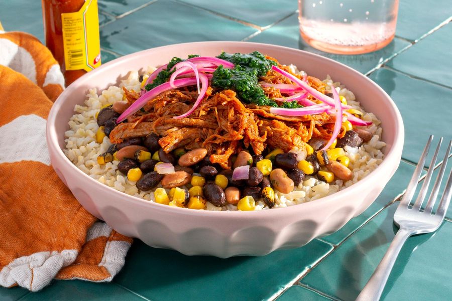 Barbacoa pork over brown rice with spiced beans, corn, and chimichurri