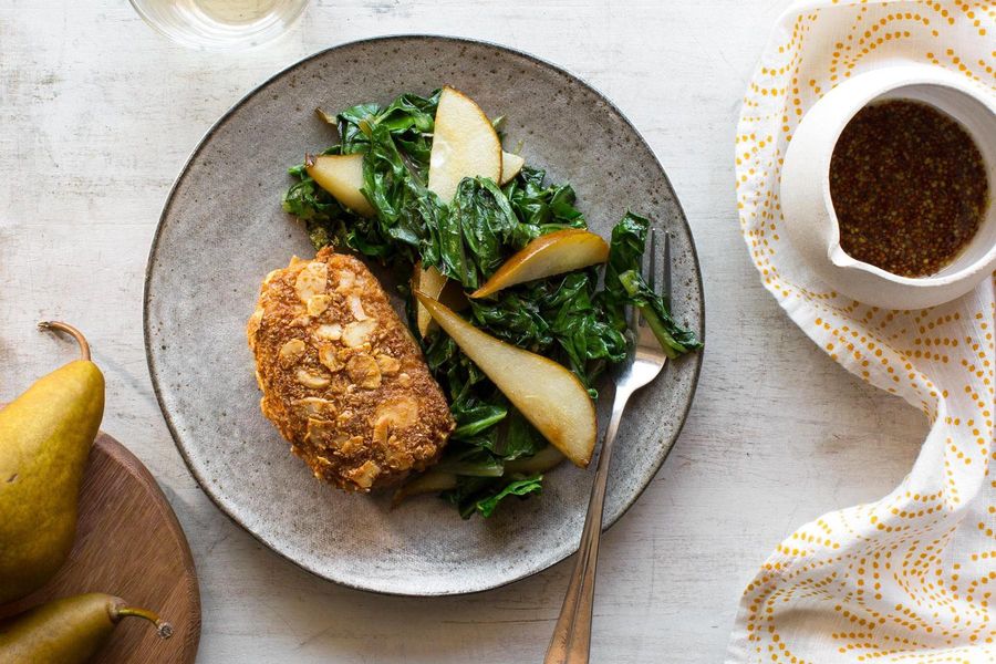 Almond-crusted pork with sautéed mustard greens and pears