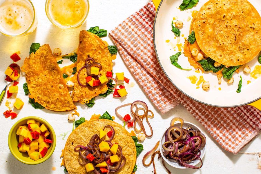 Hominy and kale quesadillas with mango salsa and caramelized onions