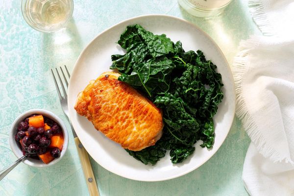 Blueberry-apricot pork chops with sautéed kale