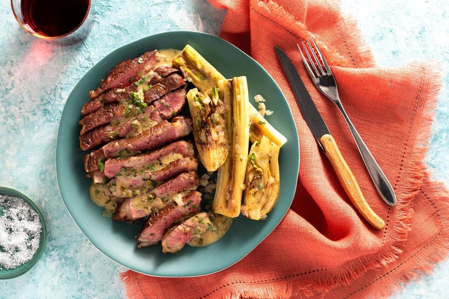 Black Angus rib-eyes with leeks and warm caper-tarragon vinaigrette