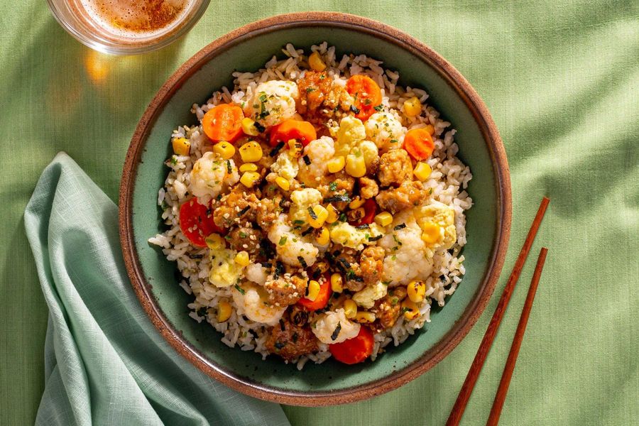 Chicken and egg donburi rice bowl with kimchi-lime vegetables
