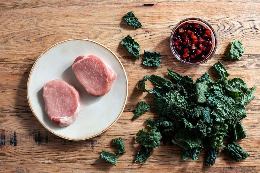 Blueberry-apricot pork chops with sautéed kale