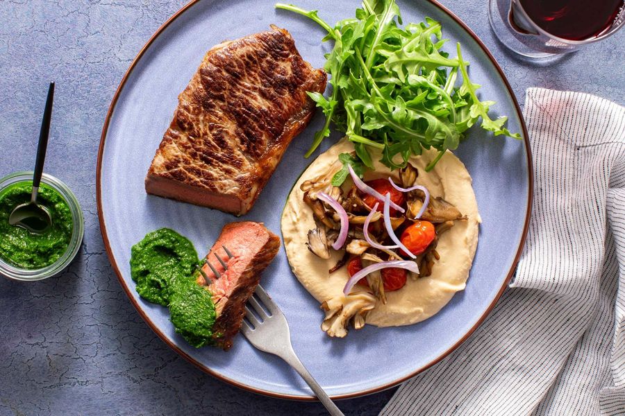 Black Angus steaks with chermoula, mushrooms, and hummus