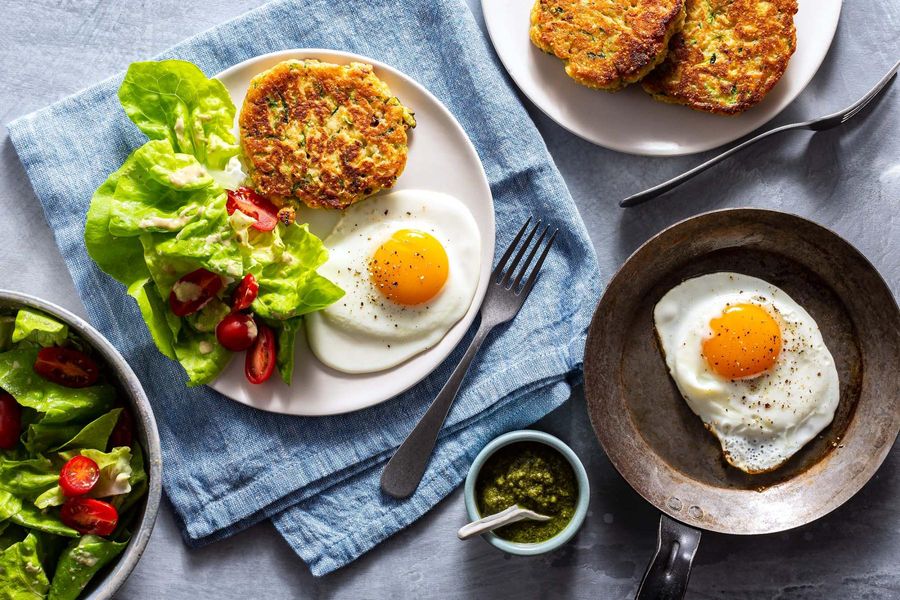 Rhode Island johnnycakes with fried eggs and arugula-pistachio pesto
