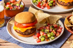 Black bean burgers with tortilla chips and kiwi pico de gallo