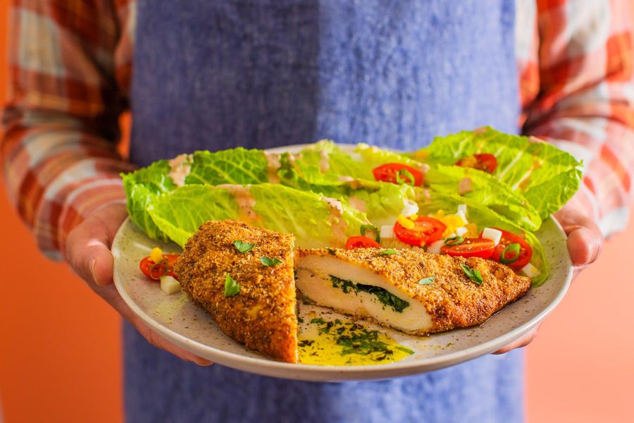 Chicken Kiev and salad with hard-cooked eggs and Russian dressing