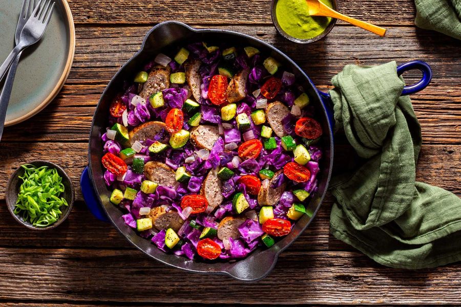 Italian sausage and vegetable skillet with spicy green harissa