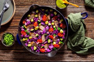 Italian sausage and vegetable skillet with spicy green harissa