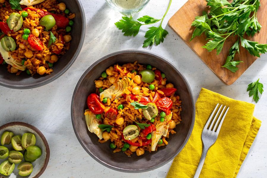 Chickpea paella with artichoke hearts, bell pepper, and tomatoes