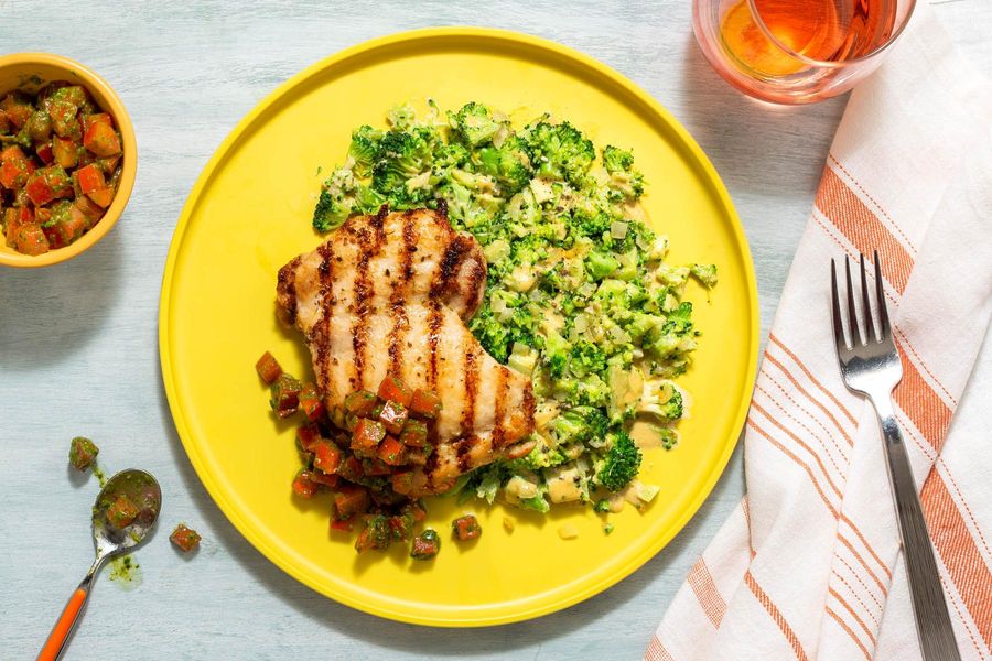 Herbed chicken thighs with “cheesy” broccoli and tomato-pesto relish