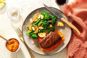 Steaks and romesco with baby broccoli, squash, and almonds