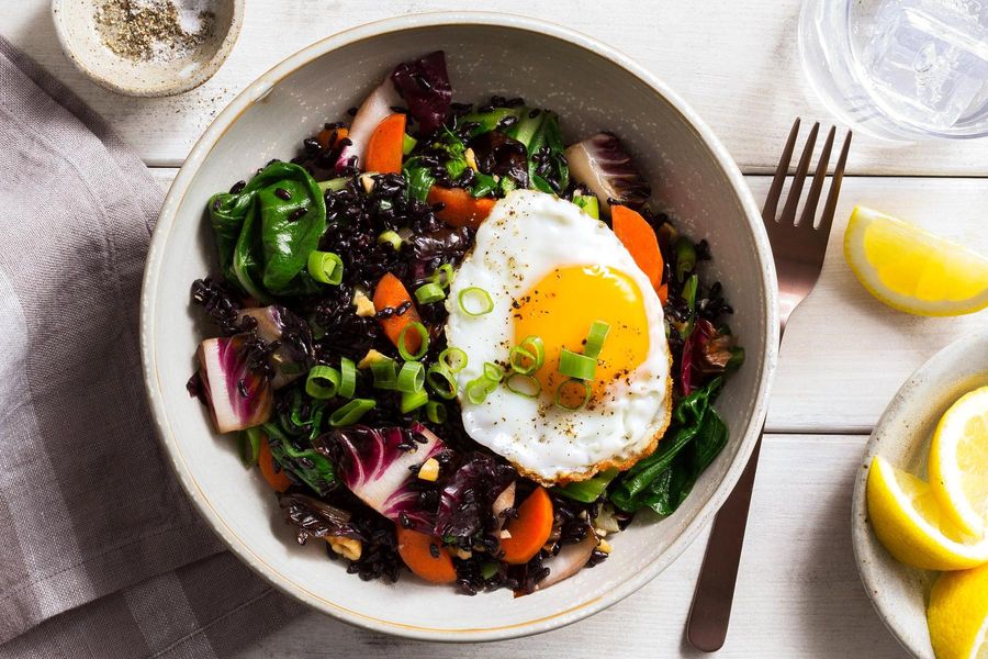 Superfood stir-fry with bok choy, black rice, and fried eggs