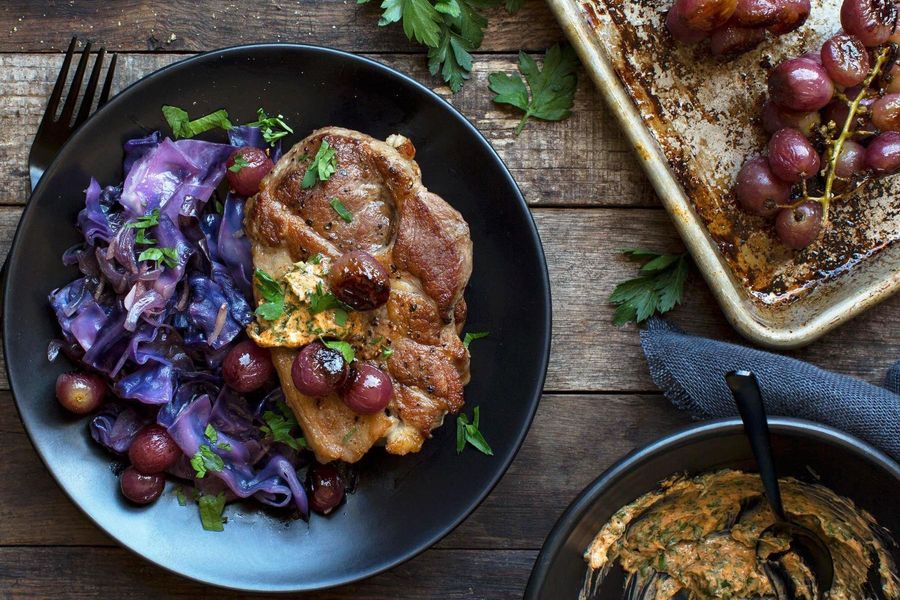 Pork blade steaks with roasted grapes and braised red cabbage