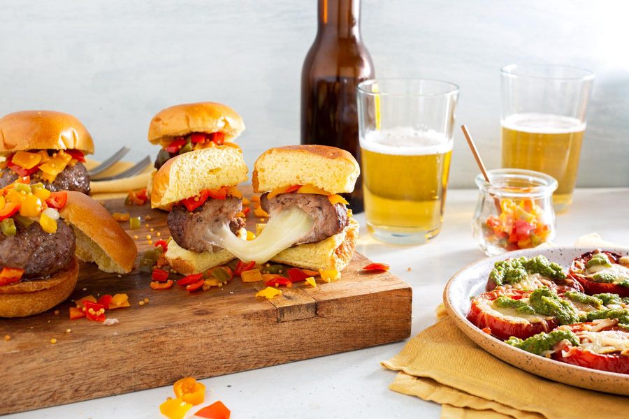 Juicy Lucy sliders with peperonata relish and warm caprese salad