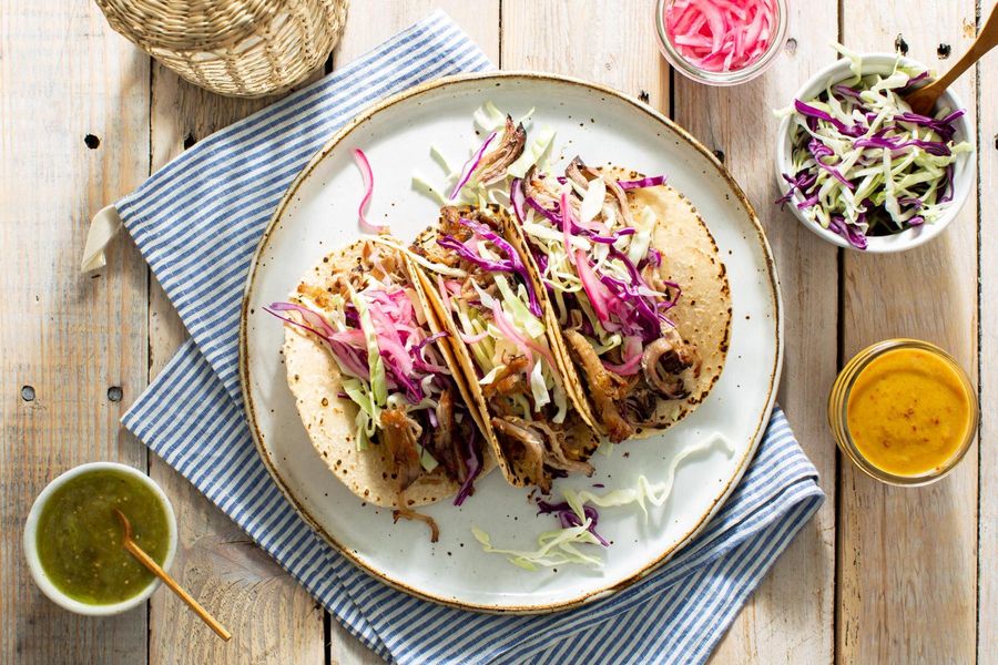 Mojo pork tacos with pickled onions and salsa verde