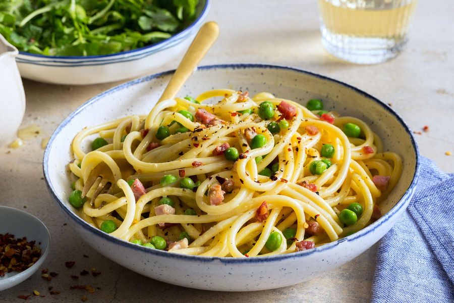 Bucatini and pancetta carbonara with arugula salad