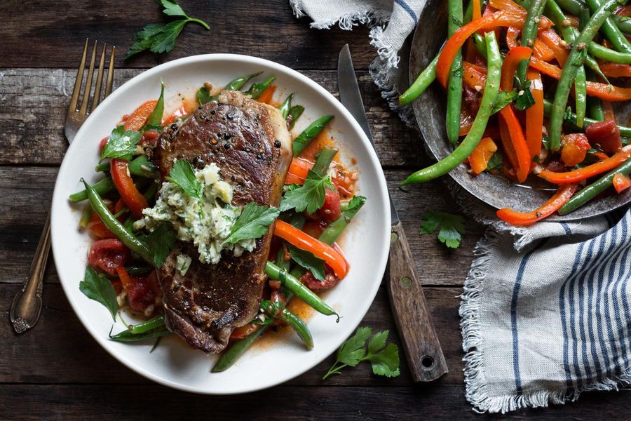 Black Angus rib-eyes with artichoke butter and green beans