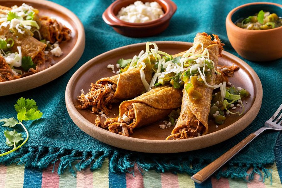Pulled-pork taquitos with tomatillo salsa verde and queso fresco