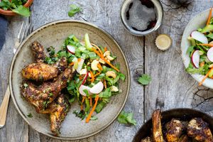 Marrakech chicken wings with sesame–bok choy slaw and cashews