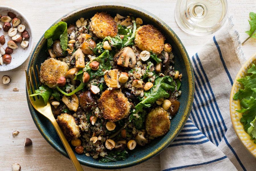 Quinoa bowls with kale, mushrooms, and goat cheese medallions