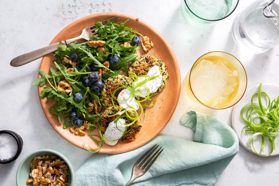 Quinoa fritters with arugula-blueberry salad and walnuts