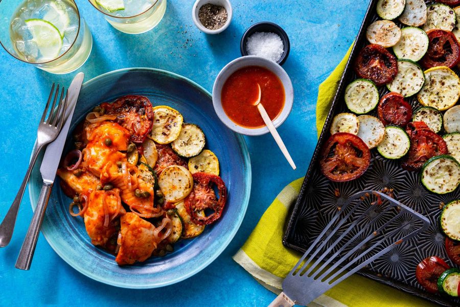 Tomato-braised pollock over roasted zucchini and new potatoes