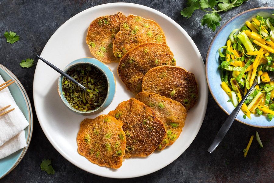 Kimchi and edamame pancakes with green mango–bok choy salad